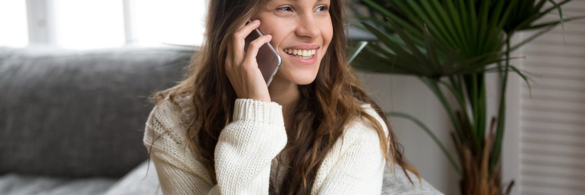 Woman smiling on the phone