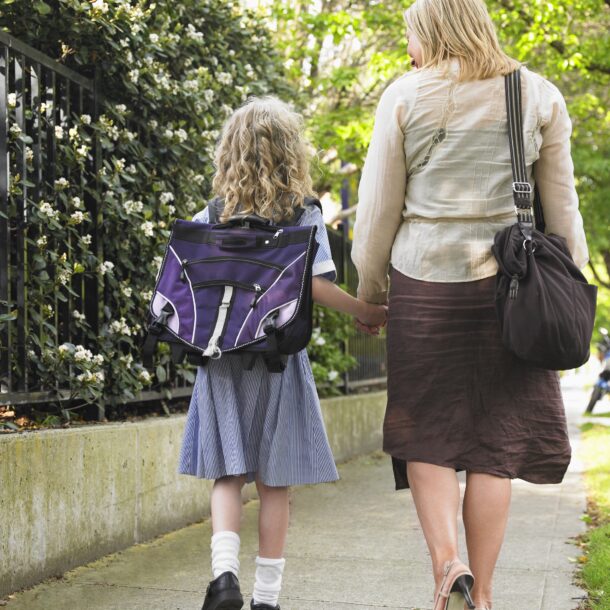 Young person walking to school with parent/carer